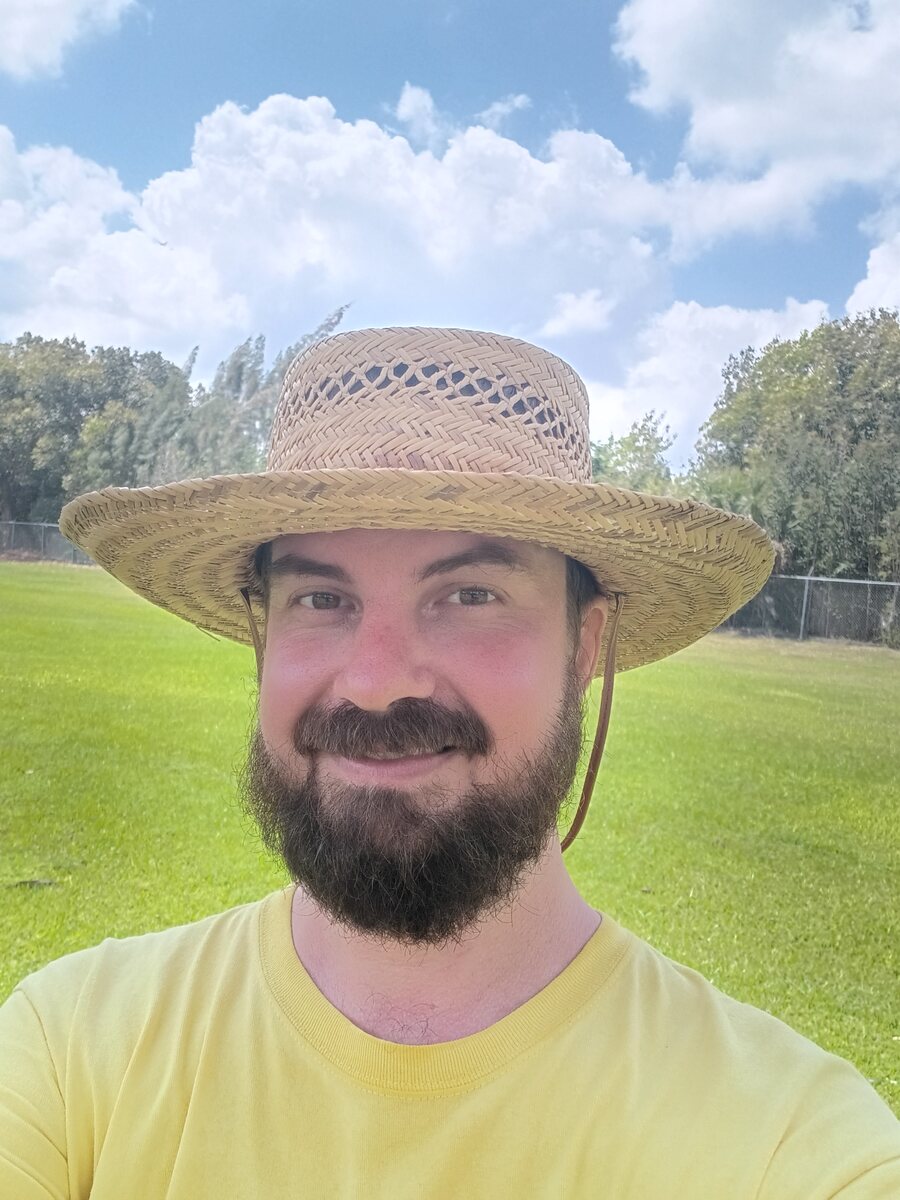 Chad Stannard outdoors wearing a straw hat
